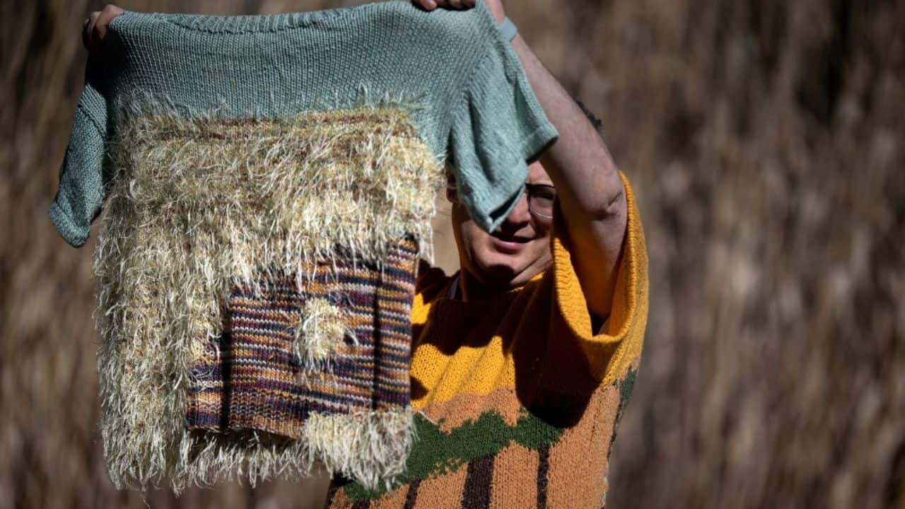 It was in the park that he kept knitting when the coronavirus pandemic brought travel to a screeching halt. The park's trees, some of which were painted in 2017 by people who overcame drug and alcohol addiction, have been immortalized on one of Barsky's sweaters against a golden background. (Source: AFP) It was in the park that he kept knitting when the coronavirus pandemic brought travel to a screeching halt. The park's trees, some of which were painted in 2017 by people who overcame drug and alcohol addiction, have been immortalized on one of Barsky's sweaters against a golden background. (Source: AFP)