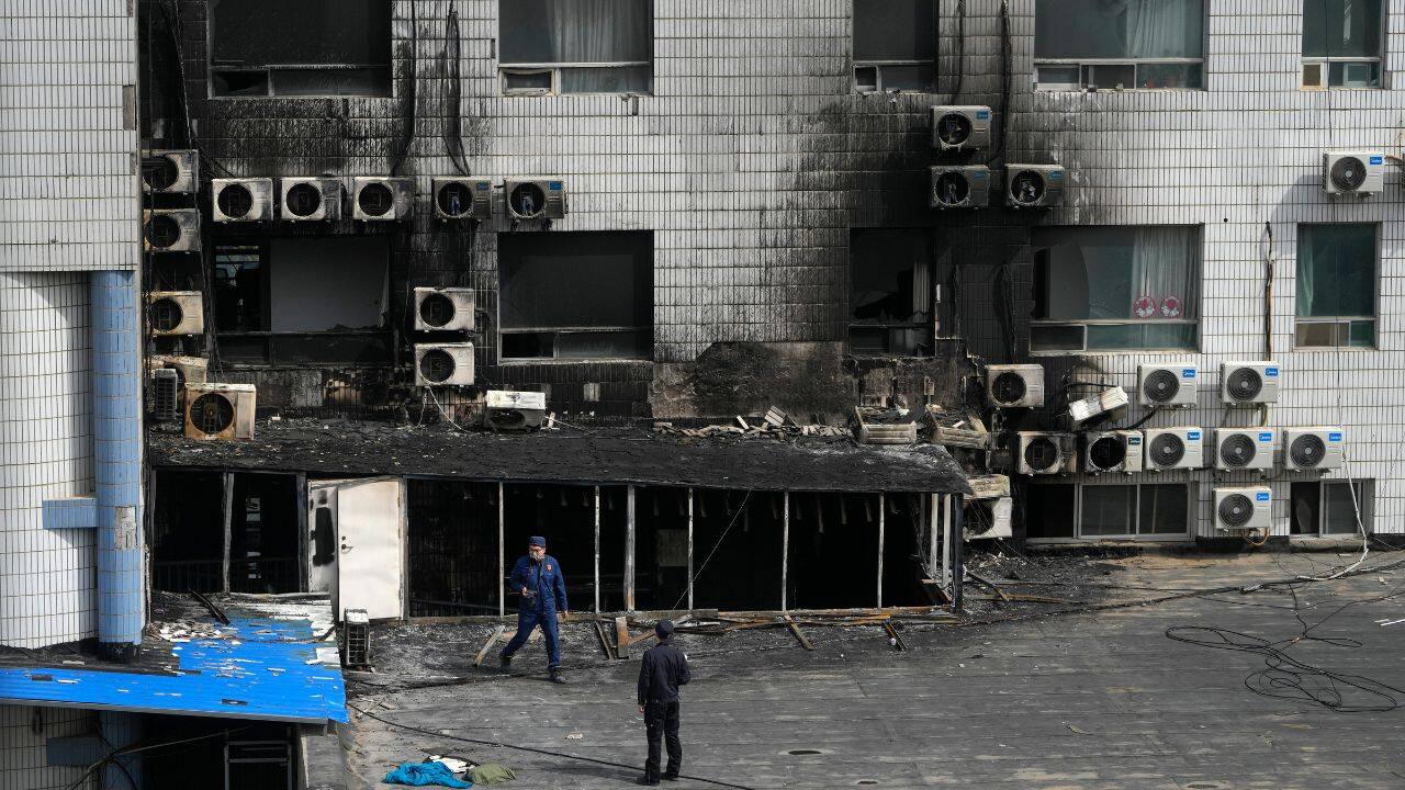 Rescue crews and medical staff from around the city were mobilized, with squads plucking some of the 142 people who were evacuated from air conditioning units on the building's exterior. (Source: AP)
