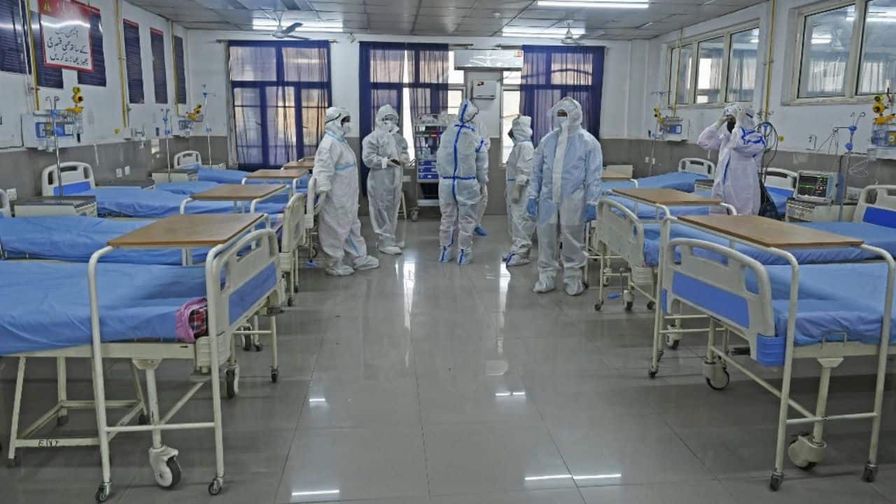 Health workers wearing personal protective equipment (PPE) take part in a mock drill to check preparations of Covid-19 facilities at JLNM hospital in downtown Srinagar. (Image: AFP)