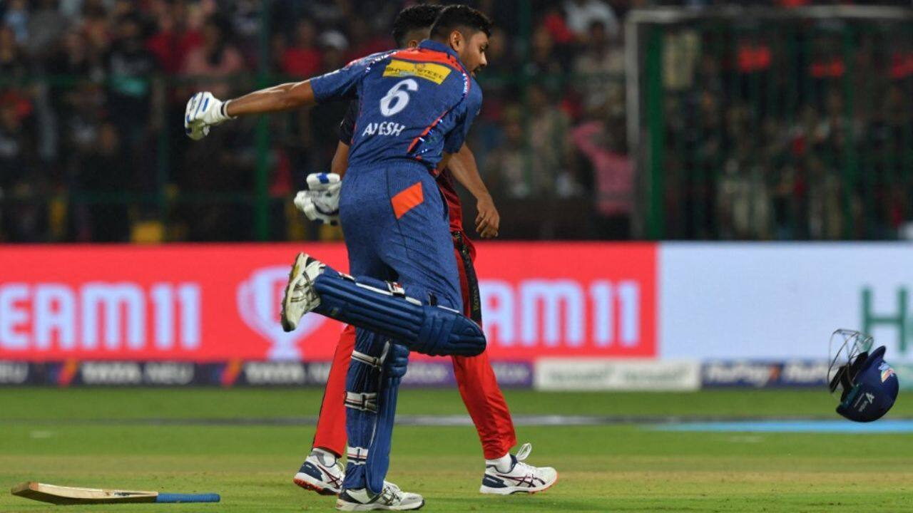 With the scores level and a super over beckoning, number 11 Avesh Khan scampered a bye and threw his helmet in celebration. (Image: AFP)