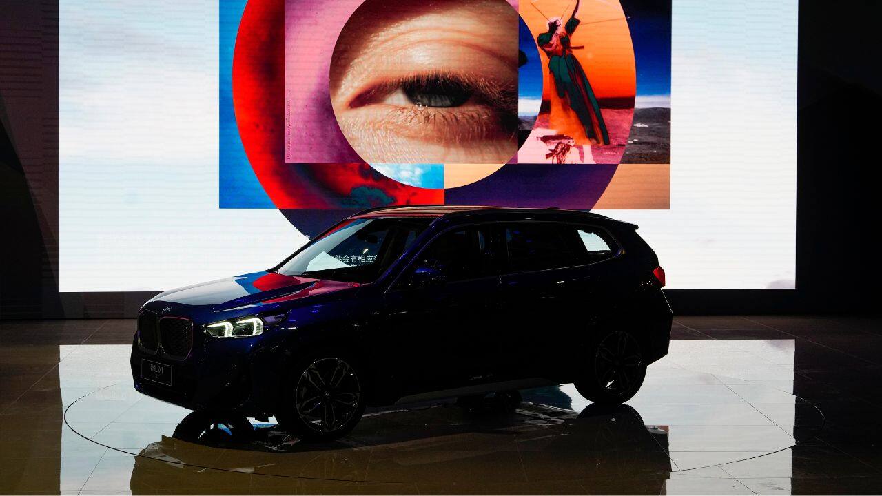 BMW's iX1, its new electric flagship SUV is unveiled in the press day of the Auto Shanghai 2023 at the National Exhibition and Convention Center in Shanghai, China. (Image: AP)