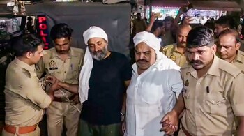 Gangster-turned-politician Atiq Ahmed and his brother Ashraf Ahmed being escorted to a hospital by police for a medical checkup, in Prayagraj, on April 15, 2023. (PTI Photo)