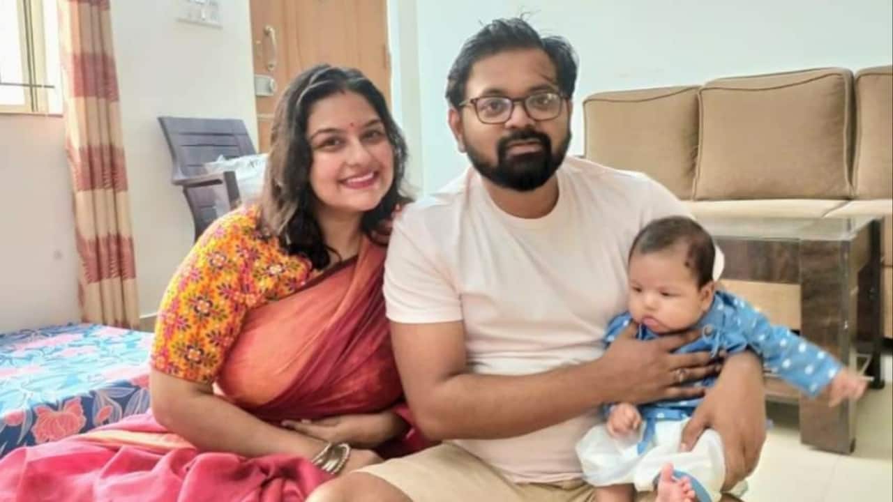 Anwesa Chakraborty with her husband and son at the Bellandur flat. (Image credit: Moneycontrol)