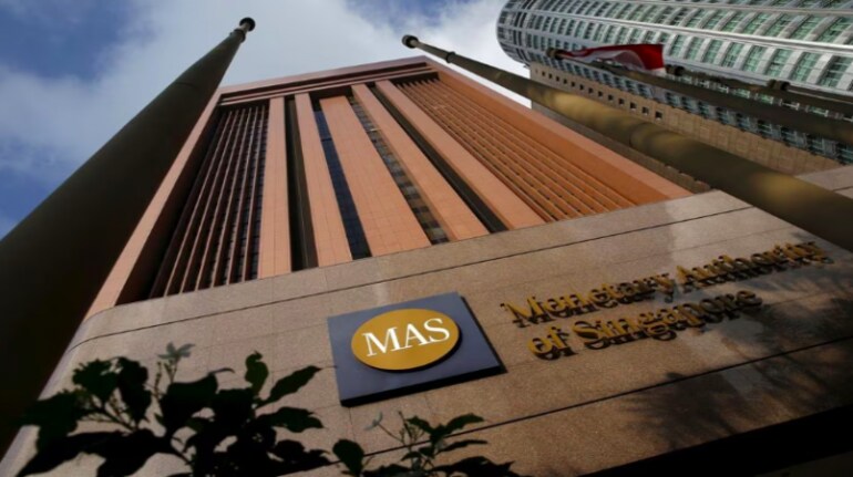 How does MAS carry out monetary policy?