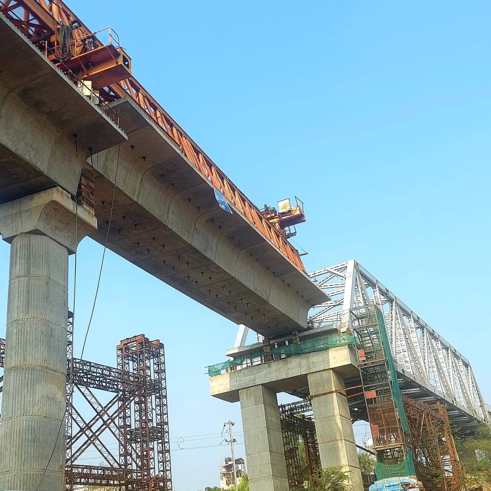 The KR Pura - Byappanahalli section was stalled due to the delay in obtaining permission from South Western Railway for the open web girder (OWG) launching over a railway track at Benniganahalli, near Byappanahalli.