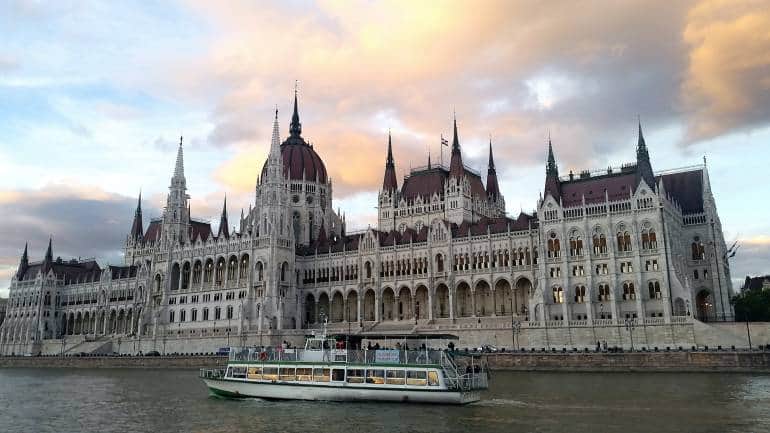 Cruising down the Danube river, flanked by the Budapest Parliament on one side. (Photo: Tudor Stanica via Unsplash)