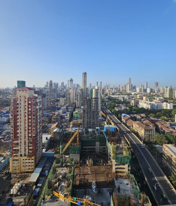The two dusty-yellow Al-Sa'adah towers dominate the chaotic Bhendi Bazaar landscape of chawls and ‘vertical slums’. (Photo by Deepali Nandwani)