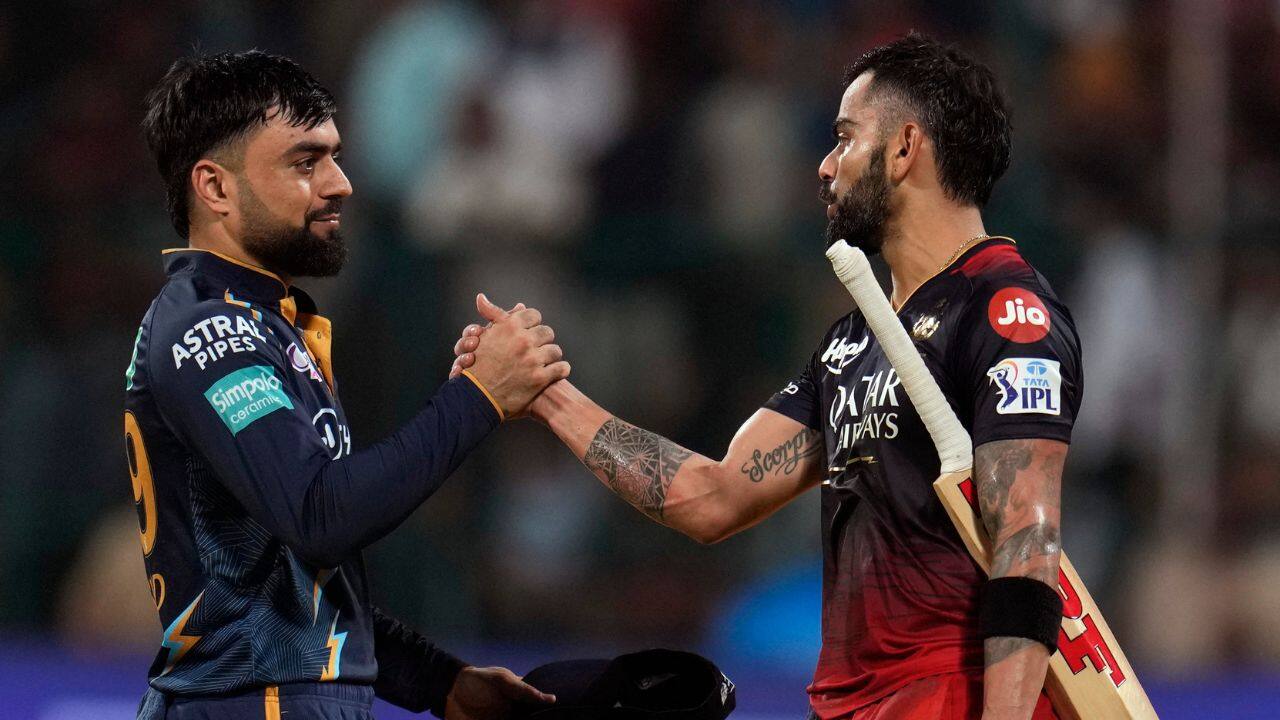 But Gujarat spinner Noor Ahmad (2-39) and Rashid Khan (1-24) squeezed the runs in the middle overs as Kohli raised his half century off 35 balls. (Source: AP)