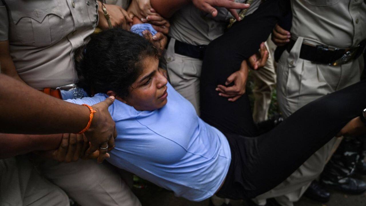Among those detained by police and hauled away into buses were Olympic bronze medallists Sakshi Malik and Bajrang Punia. (Image: AFP)
