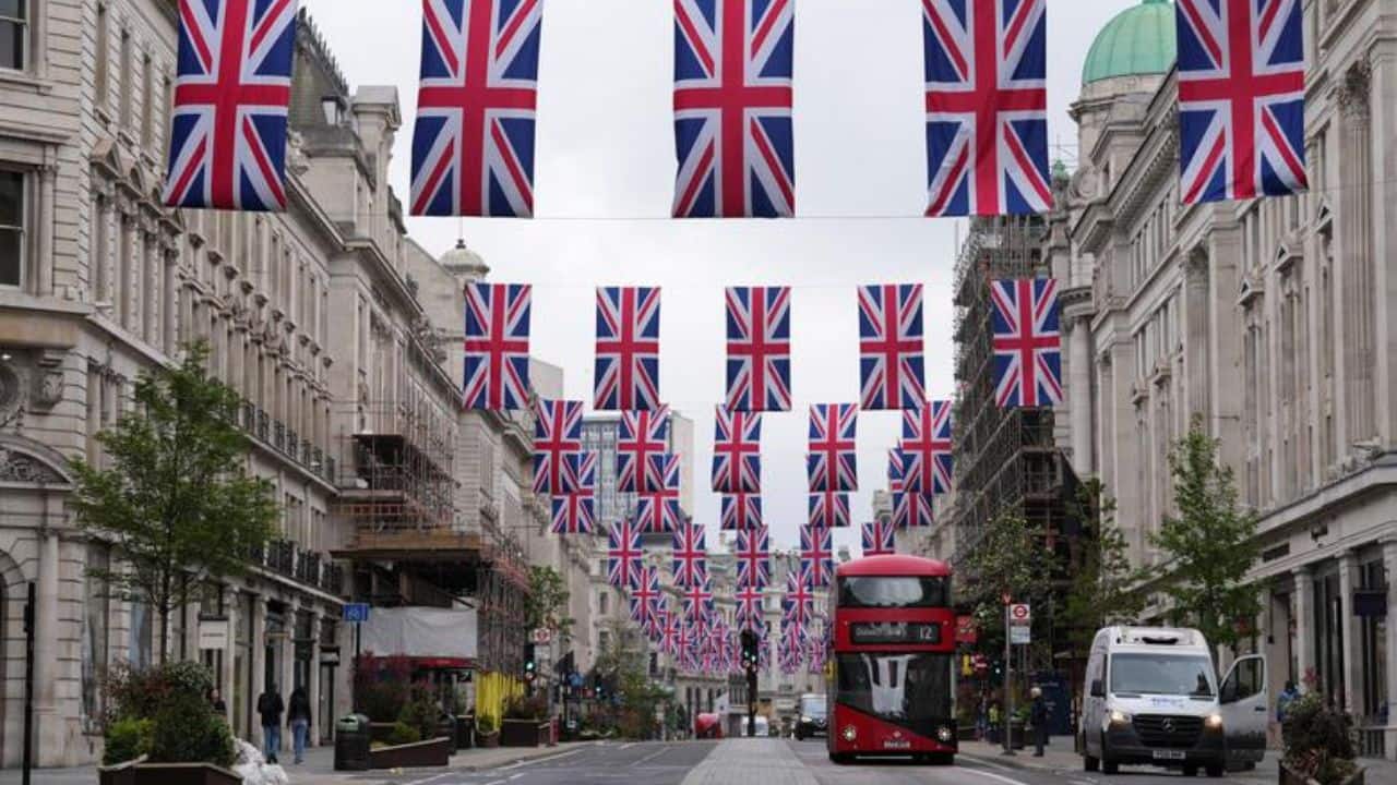 Regent Street is decorated with British flags, ahead of the Coronation of Britain's King Charles and Camilla, Queen Consort, in London, Britain, May 1. (Image: Reuters)