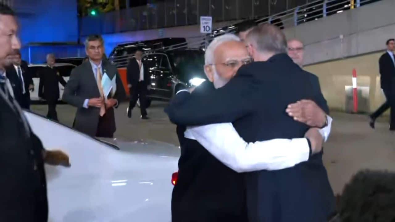 PM Modi and Albanese greeted each other with a warm hug and walked into Sydney’s biggest stadium to reverberating cheers. (Image: ANI)