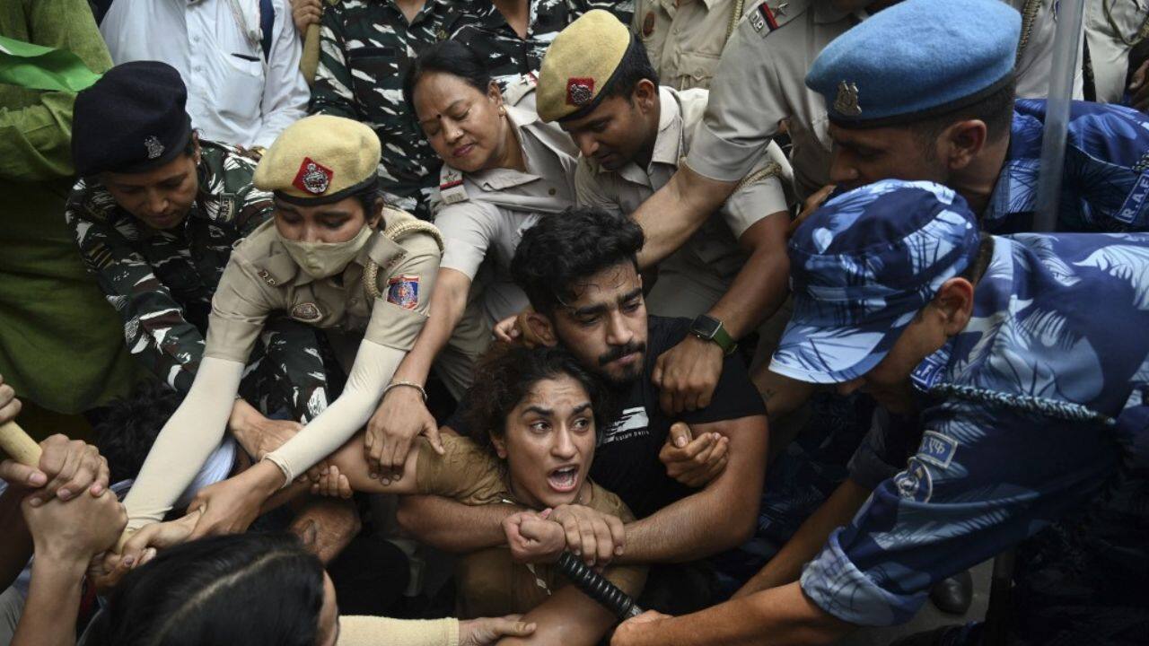 One video posted on social media by Malik showed police dragging away screaming protesters. &quot;The goon who sexually exploits, Brij Bhushan, is sitting in Parliament and we are being dragged on the road. Sad day for Indian sports,&quot; Malik tweeted. (Image: AFP)