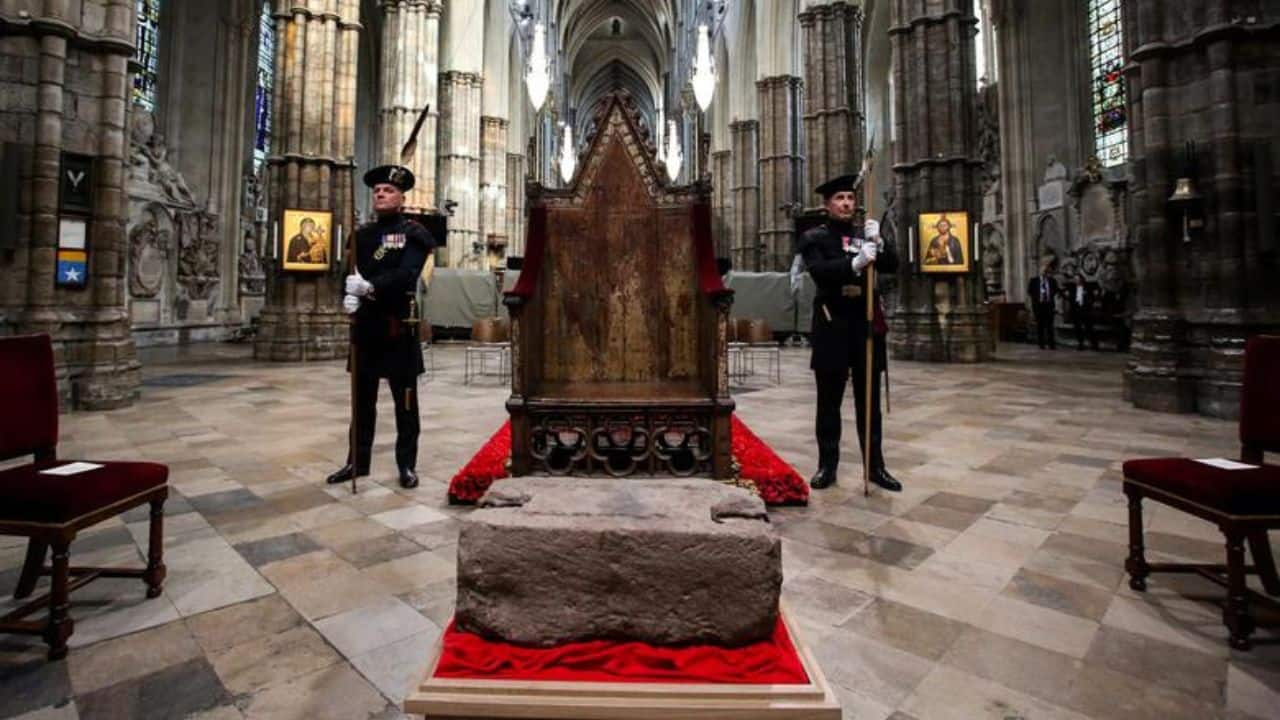 King's Bodyguards for Scotland and members of Royal Company of Archers Alex Baillie-Hamilton and Paul Harkness stand guard by the Stone of Destiny at Westminster Abbey during a welcome ceremony, in central London, Britain, April 29. The stone, an ancient symbol of Scotlandis monarchy, will play a central role in the Coronation of The King in the Abbey on May 6. In 1296, King Edward I brought the stone to Westminster. He placed it within the Coronation Chair, the oak seat he commissioned in 1300-1301 and which has been the centre piece of coronations for more than 700 years. In 1996, the UK government announced that the stone would return to Scotland, but would come back to the Abbey for coronations. (Image: Reuters)