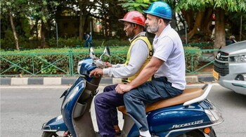 Rahul Gandhi rode 2 km on the scooter to reach his hotel in Bengaluru on Sunday. (Image credit: @DhruvJi88810158/Twitter)