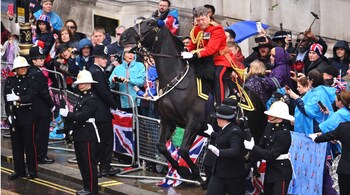 A horse backs into the crowd during the Coronation Procession after the coronation of King Charles III and Queen Camilla, in London, Saturday.
