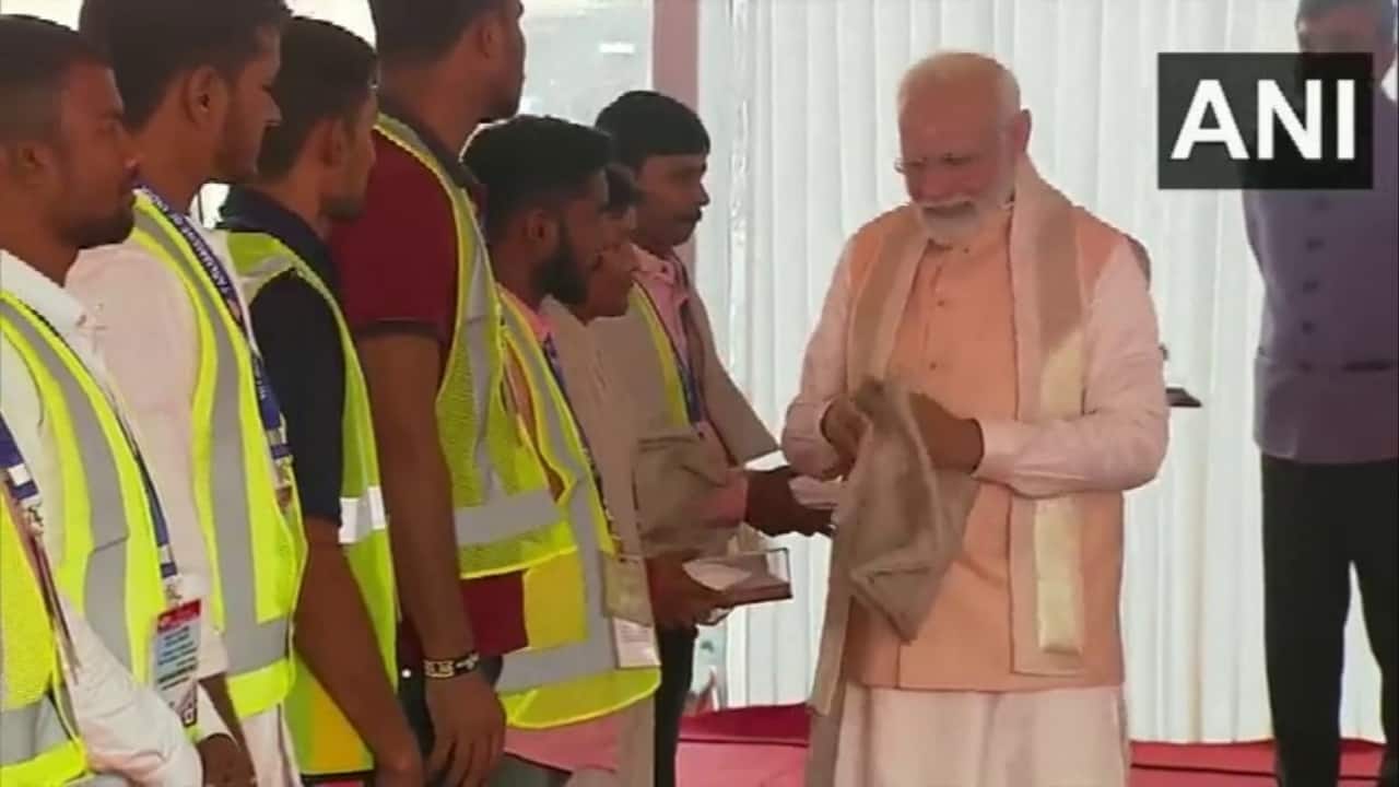 PM Modi honours construction workers at the inauguration of new parliament building (Image Source: ANI)