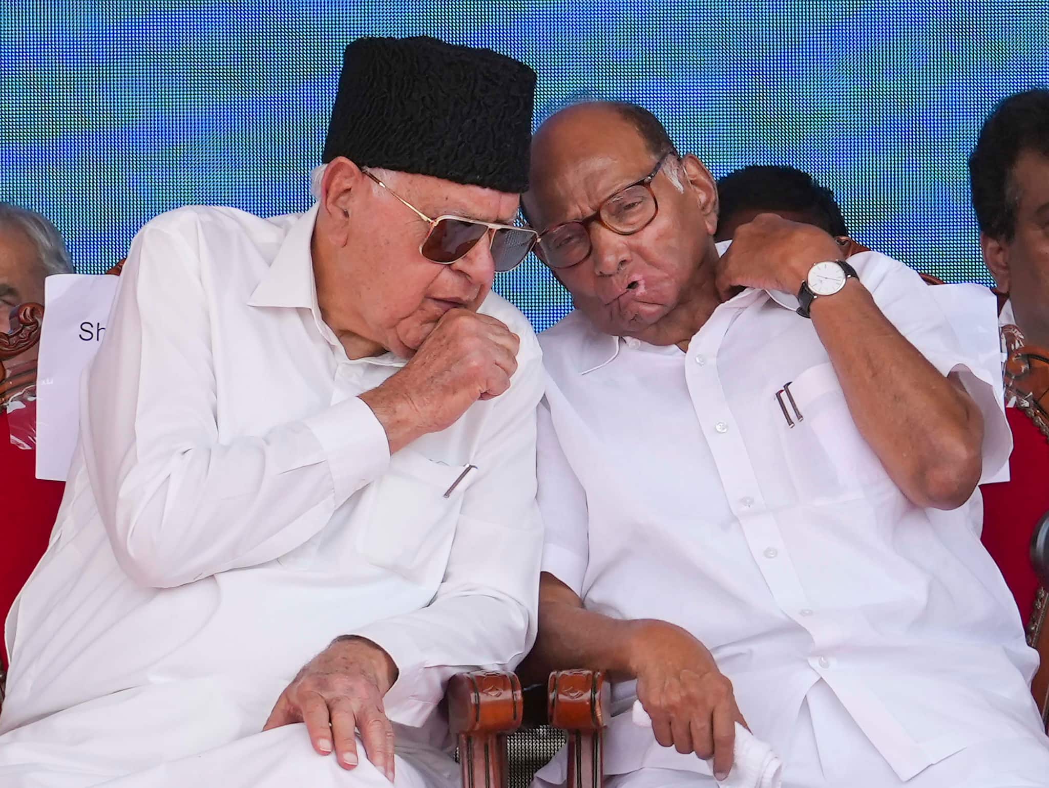 National Conference leader Farooq Abdullah (left) and Nationalist Congress Party (NCP) president Sharad Pawar (right) were among those seated at the dais during the oath-taking event. (PTI photo)