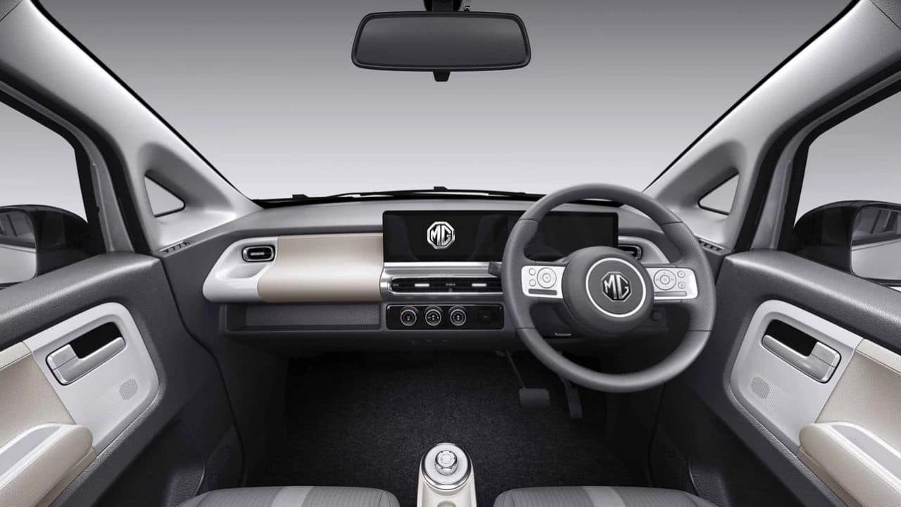 Features | The Comet is absolutely packed with features. To start with, you get two free-standing displays, each measuring 10.25 inches. While one works as the driver’s instrument cluster, the second is the infotainment screen. This comes with Apple CarPlay and Android Auto for smartphone connectivity and connected car tech. The steering wheel is a two-spoke unit with controls that mimic an old Apple iPod; pretty fancy in a millennial kind of way. Unfortunately, there is no auto climate control and no auto headlamps, but the lights are all LED. One of the fancier features, however, is the fact that the Comet doesn’t have a start-stop button. Instead, you start up the car by holding down the brake pedal for two seconds, and turn off the engine by leaving the car and locking it. It is a little gimmicky, but MG has added an emergency off switch under the dash for extra safety. Then there are the paint schemes. MG only gives you four base paint schemes – black, white, grey, and apple green. But MG has a list of stickers and decals you can use to make things funkier given the Comet’s already funky exterior design. (Image: MG Motor)