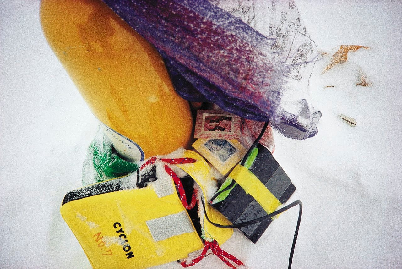 The only summit photo Venables could make, his reflection is seen on the oxygen bottle left behind by a previous expedition. (Photo credit: Stephen Venables)