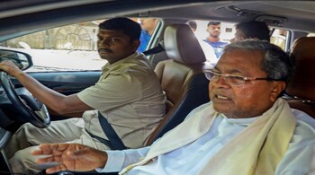 Congress leader Siddaramaiah leaving his residence for Delhi to meet senior party leaders (PTI Photo)