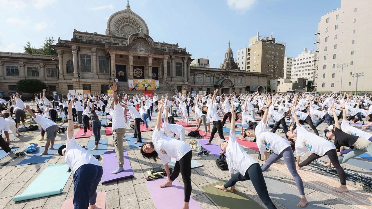 Massive gathering of 650 individuals engage in yoga practice at Tokyo's Tsukiji Honganji temple on International Day of Yoga. (Image: AFP)