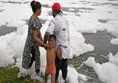 World Environment Day: Families bathe in toxic foam floating on Yamuna. Check pics
