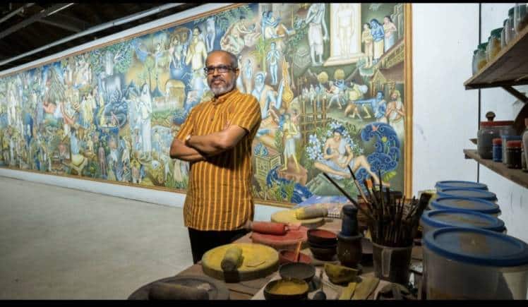 Mural artist PK Sadanandan with his artwork.