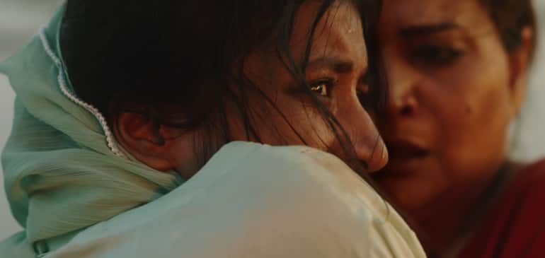 Ramesha Nawal and Bakhtawar Mazhar in a still from the Cannes-premiered Pakistani horror thriller 'In Flames'. (Image courtesy Citylights Media)