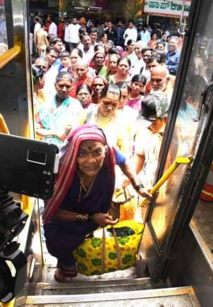 Within minutes of the scheme's launch, the photograph of a woman named Ningavva Shiggadi bowing and touching the bus' footboard with her forehead as she boarded it, went viral. 
