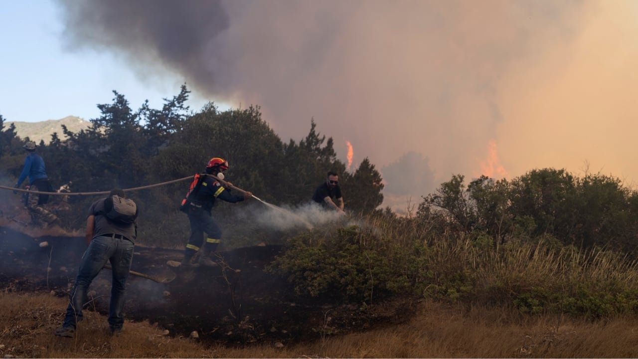 Fires have been raging across Greece, including outside the capital Athens and in Rhodes, fueled by three consecutive heat waves. Five people have died in the fires, including two firefighter pilots. Temperatures pushed 40 degrees Celsius (104 degrees Fahrenheit). (Source: AP)