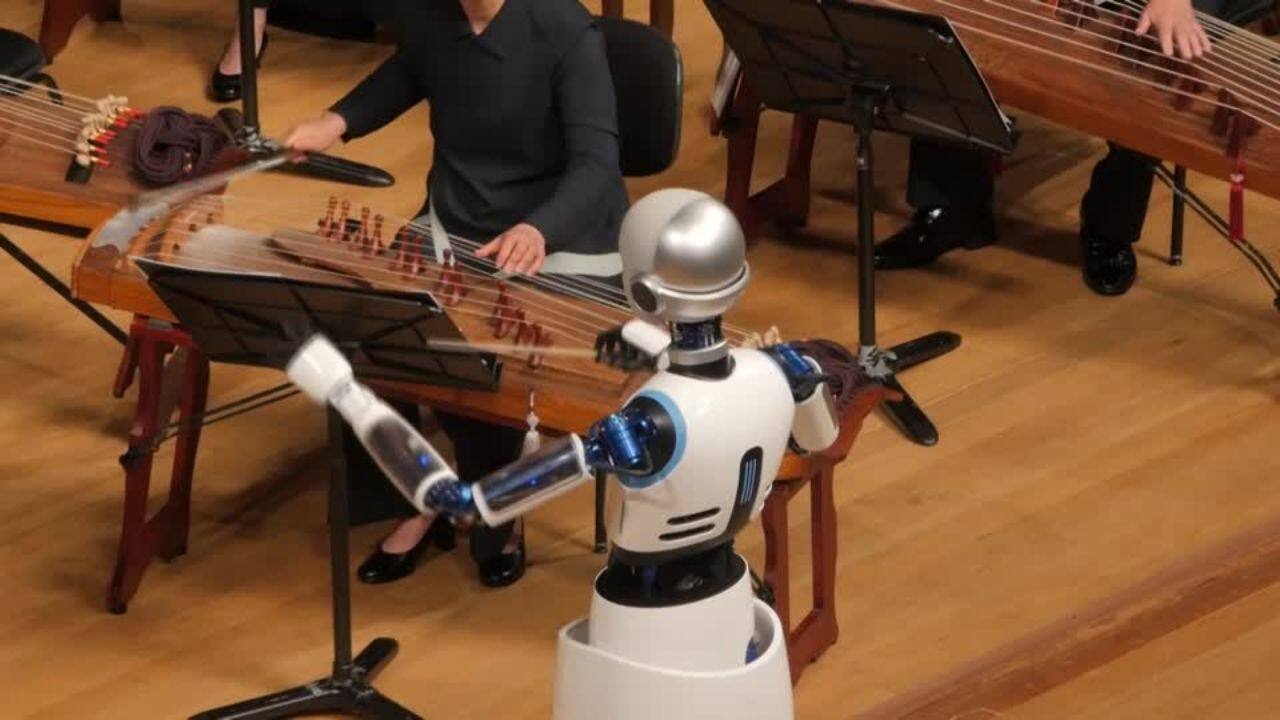 The robot, with a humanoid face, first bowed to the audience and started waving its arms to control the tempo of the live show.&quot;Movements by a conductor are very detailed,&quot; Choi Soo-yeoul, who led Friday's performance alongside the robot, said. (Image: Reuters)