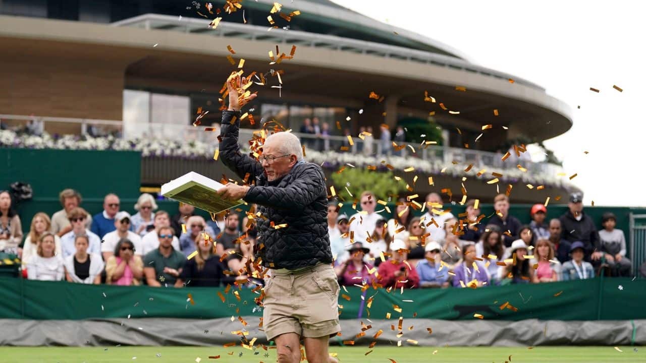 Grigor Dimitrov was about to serve at Wimbledon when two environmental activists jumped out of the stands at Court 18 and disrupted his match by scattering orange confetti and puzzle pieces on the grass. His initial instinct Wednesday? Get involved and try to stop them.“But then I also realized,” the three-time Grand Slam semifinalist said, “that’s not my place to do that.” (Source: AP) Grigor Dimitrov was about to serve at Wimbledon when two environmental activists jumped out of the stands at Court 18 and disrupted his match by scattering orange confetti and puzzle pieces on the grass. His initial instinct Wednesday? Get involved and try to stop them.“But then I also realized,” the three-time Grand Slam semifinalist said, “that’s not my place to do that.” (Source: AP)
