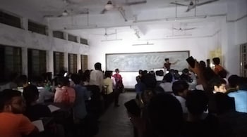 Raj Vikramaditya is seen teaching his juniors coding with the help of flashlights in 2017. (Image credit: @striver/Twitter)