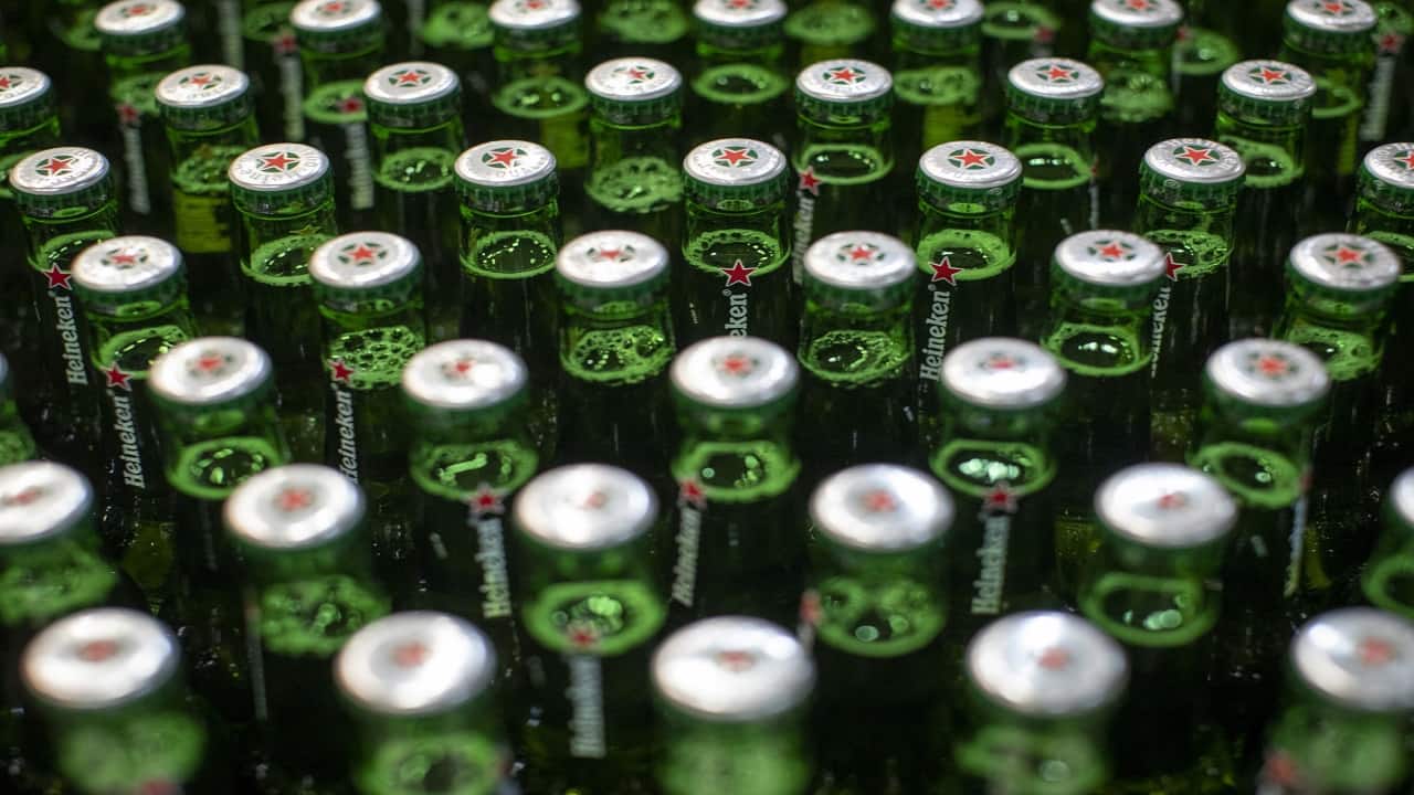 Heineken lowers earnings forecast as beer consumption drops