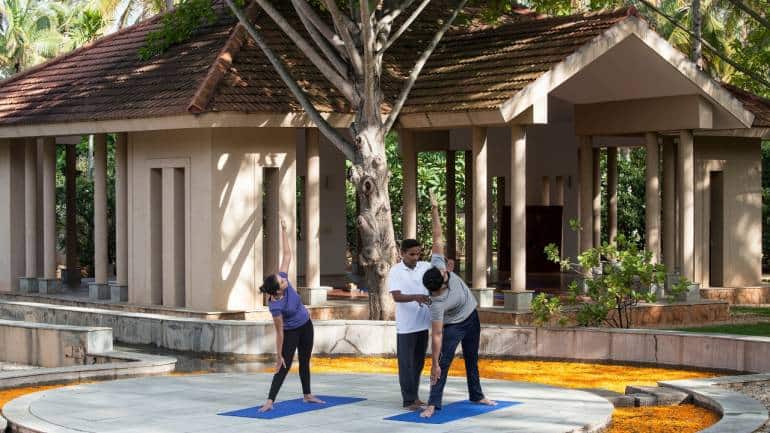 India's best wellness resort Yoga at the outdoor pavilion at Shreyas Yoga Retreat, Bengaluru