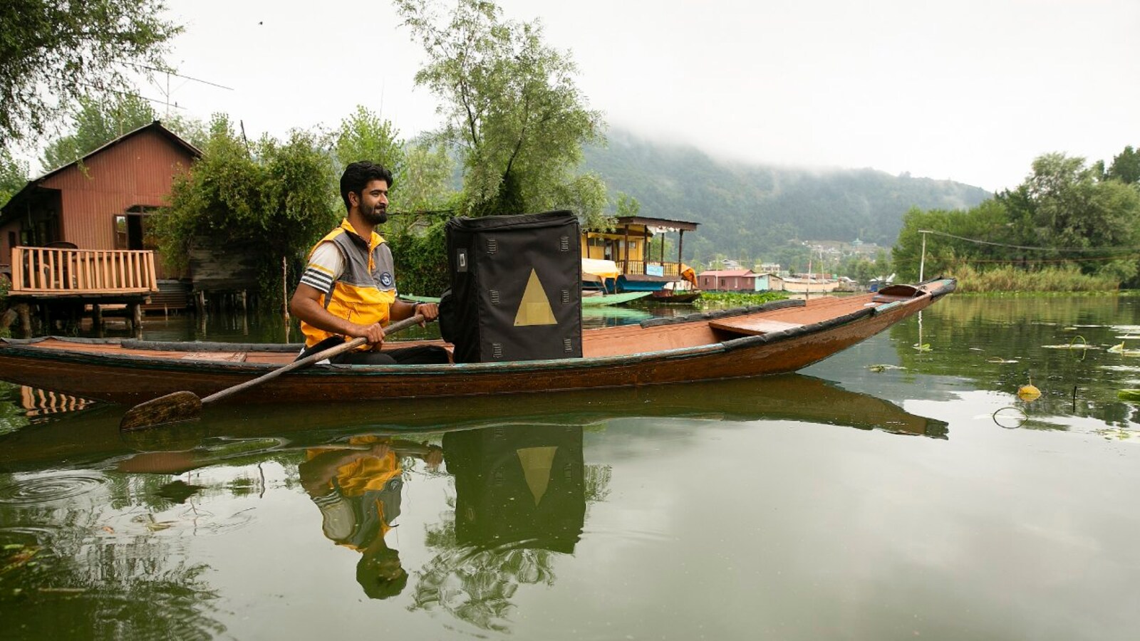 Why a houseboat owner in J&K launched  India's first floating store  in Srinagar