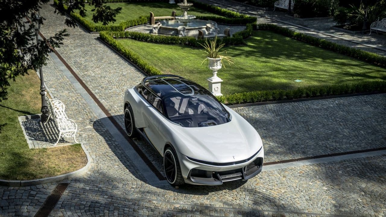 While its overall height and ground clearance suggest a high-riding SUV, the sleek, curvy nature of the panels suggest otherwise. The front is characterised by a chunky face sliced in the centre to make way for very slim headlights. The headlights themselves work using nanofibre, each of which are 1 mm thick. This allows for extremely intricate shapes when the Daytime Running Lamps or DRLs are on. Lower down, you have a bumper made of exposed carbon fibre and large air intakes for cooling and aerodynamics. (Image: Automobili Pininfarina)