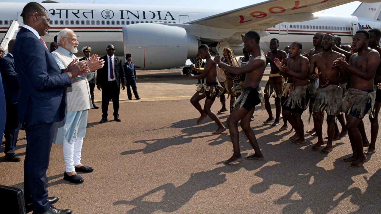 PM Modi was accorded a ceremonial welcome with a traditional dance performance on his arrival at the Waterkloof Air Force Base. This is Prime Minister's third visit to South Africa. (Image: Reuters)