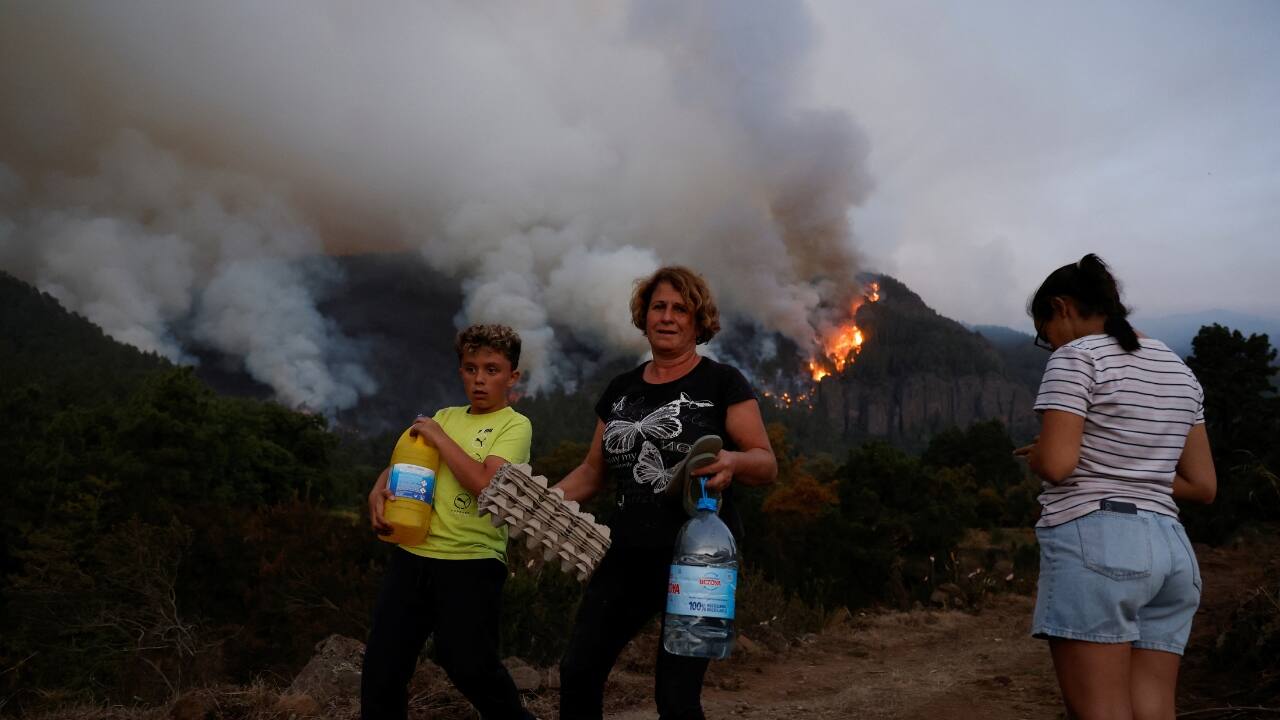 &quot;When you go outside you start suffocating. It's as if you have something stuck in your throat,&quot; said Alba Gil, 37, resident of the village of La Esperanza where authorities ordered people to stay home due to the heavy smoke. She and her family stayed up until 4 a.m. worried about the flames higher up the mountain. (Image: Reuters)