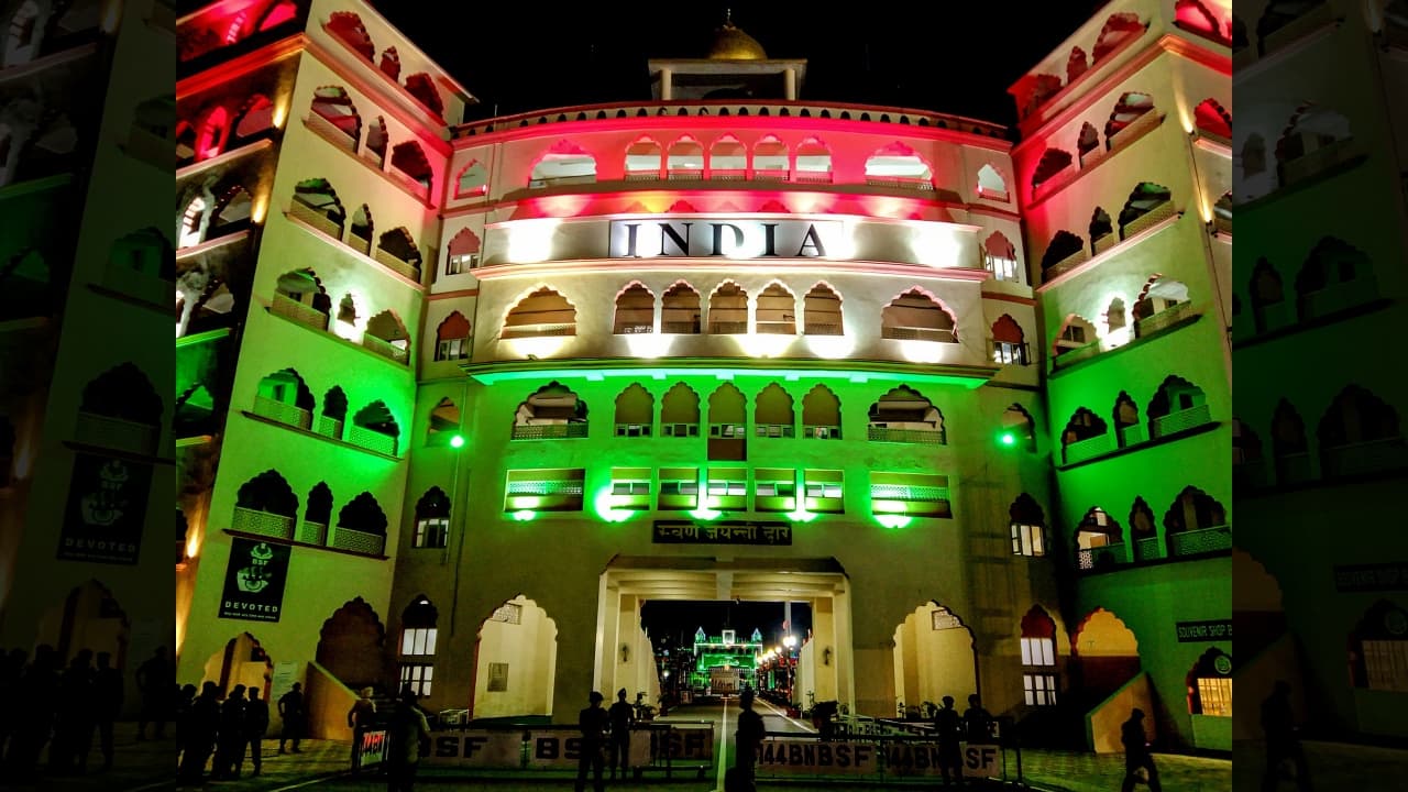 The gate at the Attari-Wagah border illuminated in the colours of the national flag on the eve of Independence Day, in Attari. (Image: PTI)