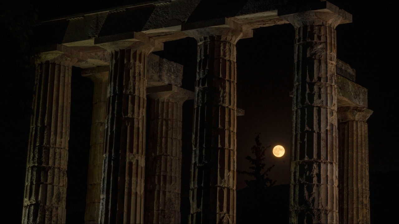 The supermoon rises behind the ancient Temple of Zeus in ancient Nemea about 100 kilometres (62 miles) southwest of Athens on August 1. (Image: AP)