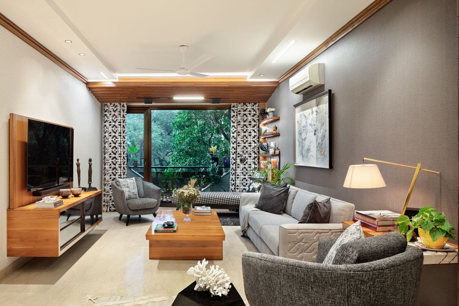 A bench sits near the living room window overlooking the wide expanse of Delhi's ridge. Photo courtesy Devika Khosla The Works Interiors