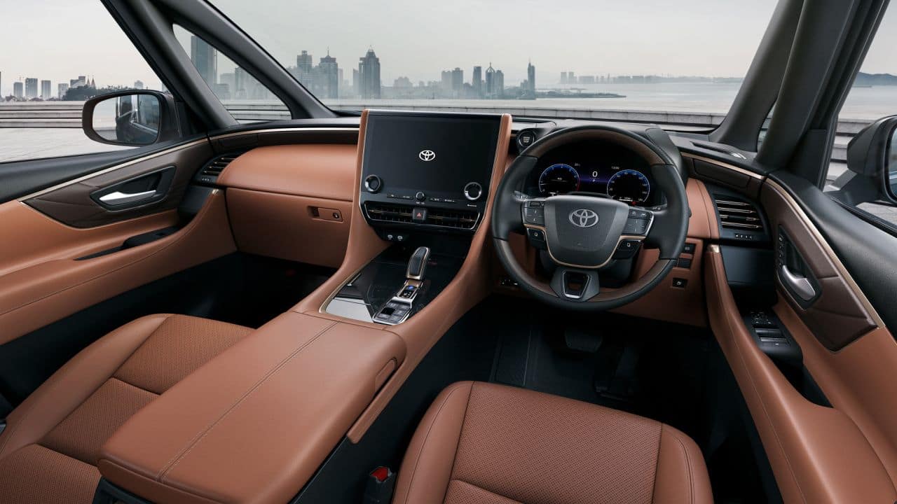 On the inside, the dash is a lot more simplistic. The 14-inch touchscreen infotainment system now integrates most of the buttons that control various functions in the car. The seats are more comfortable and there is a large overhead console for passengers. The top spec VIP – Executive Lounge trim of the vehicle gets some additional equipment over the standard Hi trim. The two captain seats in the second row get heating and ventilation functions as well as retractable tables. (Image: Toyota)