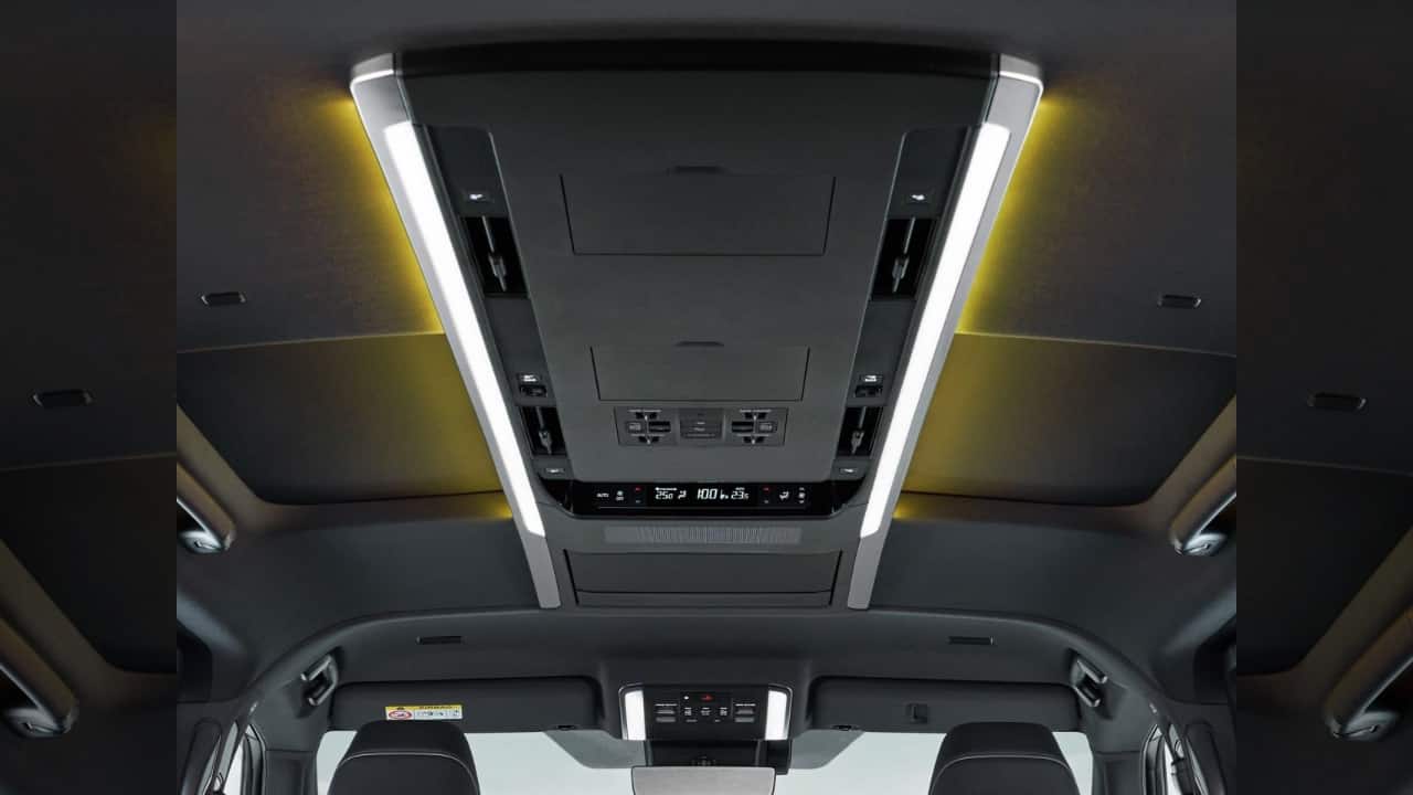 The arms also hold a detachable control unit for passengers to access different functions within the car such as media and climate control settings. Apple CarPlay and Android Auto come standard, as does a 15-speaker JBL audio system. Other features include an 8-way power adjustable driver’s seat, head-up display, massage function for the second row, independently operable sunroofs, power roll-down sunblinds for the rear, and over 60 more features thanks to connected car tech. Now, while the Hi trim gets the captain seats in the second row, it also gets an ottoman function. (Image: Toyota)