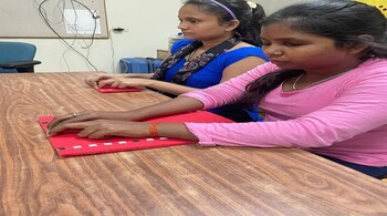 Visually challenged women at the National Association for The Blind (NAB) learn how to screen breast cancer
