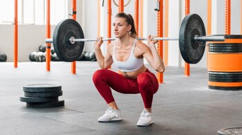 Exercise and fitness for leg muscles Barbell Squats (Image: Canva)