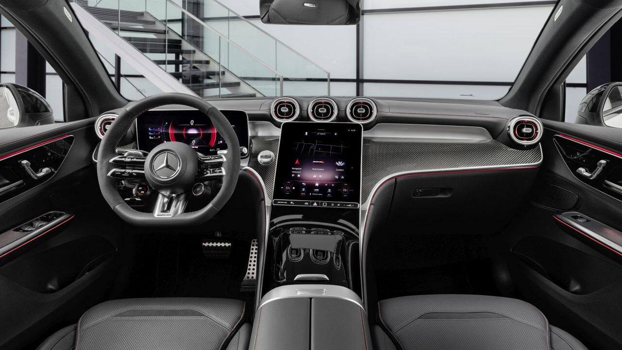 Over on the inside, the layout remains identical to the standard GLC coupe but AMG-specific touches such as the steering wheel, floor mats, sport seats and pedals have been added to mark the difference. Everything else remains the same with the 11.9-inch portrait-oriented infotainment system and 12.3-inch digital driver’s display, but with AMG-specific graphics. (Image: Mercedes-Benz)