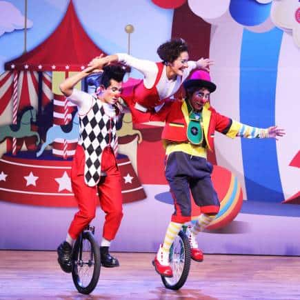 Rolling into the show with a unicycling stunt