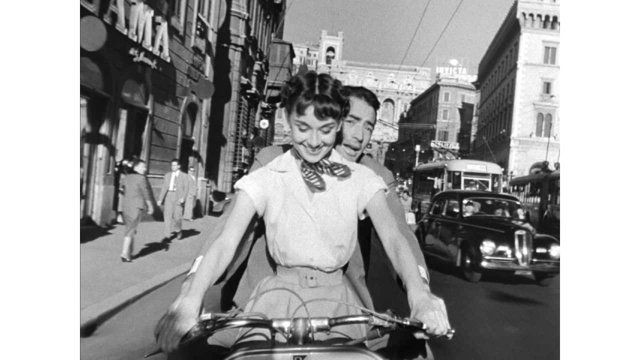 Audrey Hepburn and Gregory Peck (Image from the trailer for the film Roman Holiday via Wikimedia Commons)