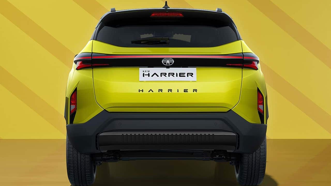 Tata has given the 2023 Harrier a striking exterior makeover that aligns with the design philosophy seen in the Tata Nexon. The front end boasts slim LED Daytime Running Lights (DRLs) connected by a full-width LED light bar, creating a distinctive look on the road. Just below, a broader grille seamlessly integrates with the LED DRL lines, giving the vehicle a bold presence. The large central air intake further down gets unique inserts like the parametric grille above. (Image: Tata Motors)